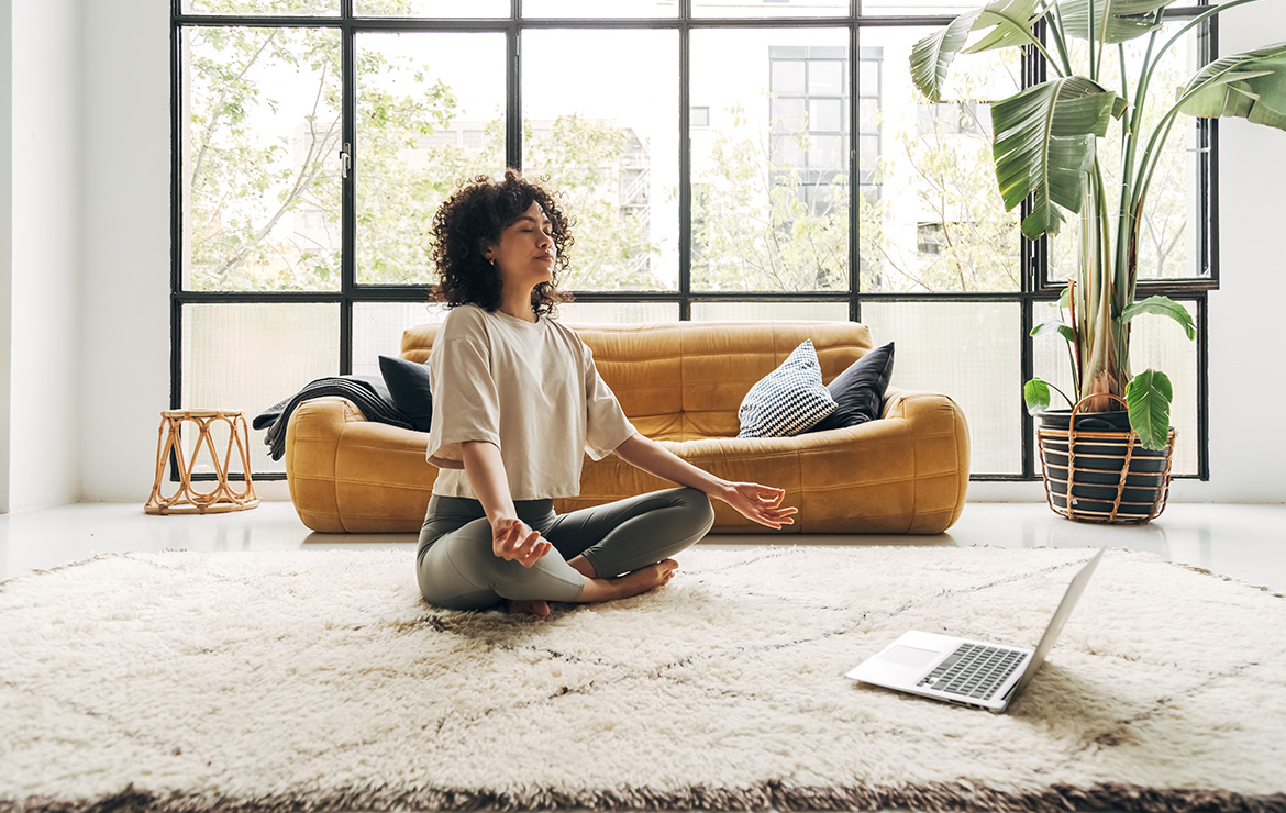 Focused individual practicing mindful breathing in a tranquil indoor space